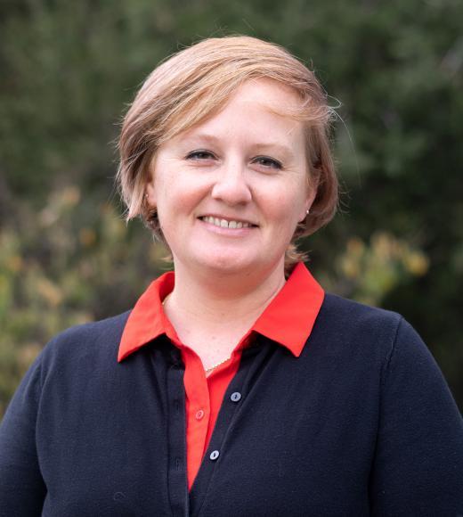 A professional headshot of Dr. Jennifer Cash. She is a light-complected woman with short blonde hair.