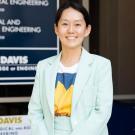A picture of Dr. Shirley Ahn. She is standing outside of Bainer Hall and smiling for a professional headshot.